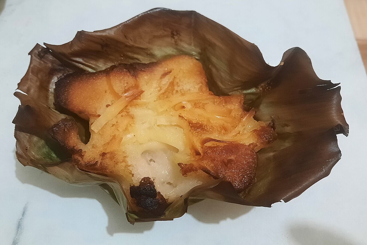 Bibingka: Filipino Coconut Rice Cake - Single bibingka with traditional presentation.