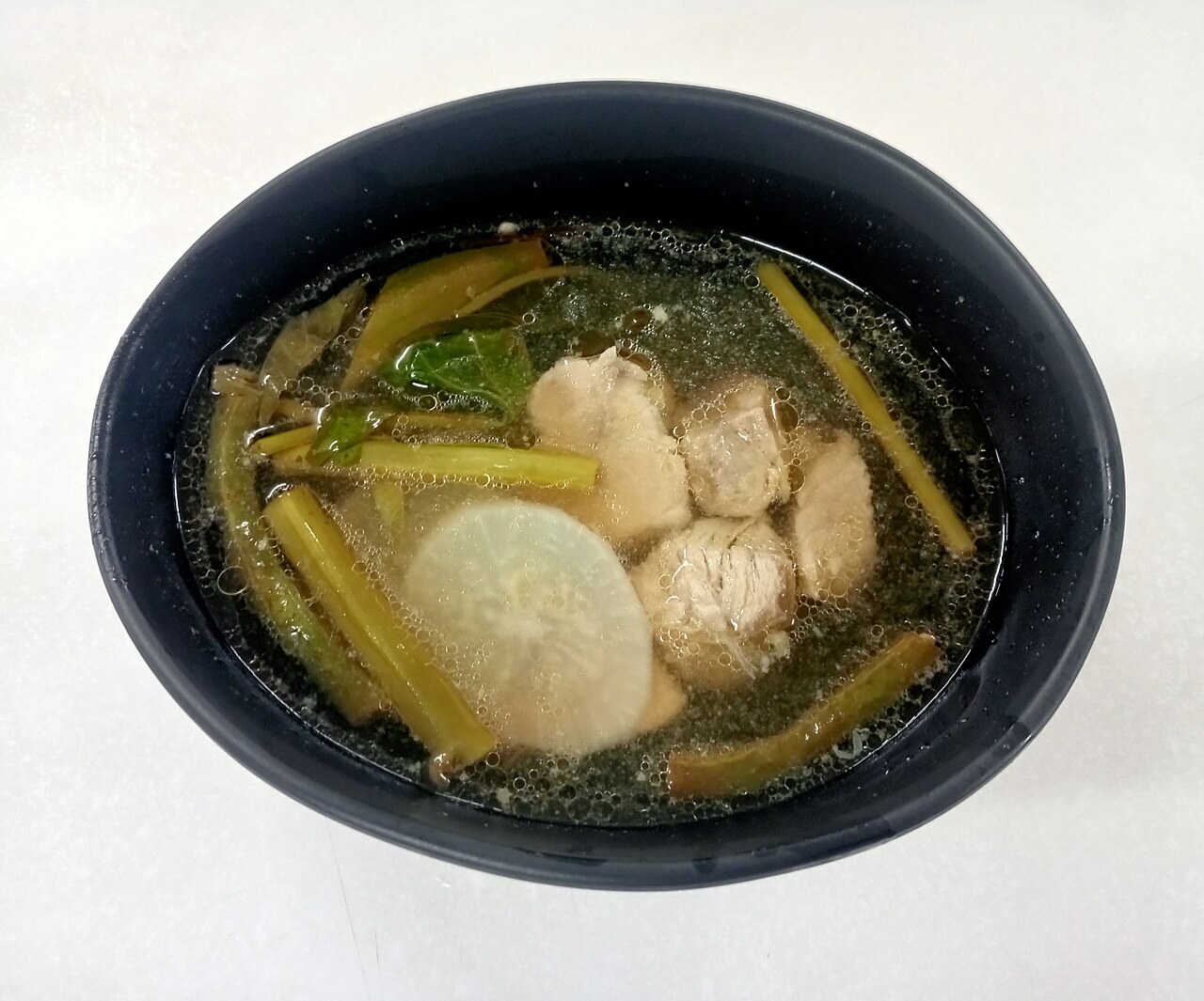 Pork Sinigang: Filipino Tamarind Soup with Vegetables - A bowl of pork sinigang.