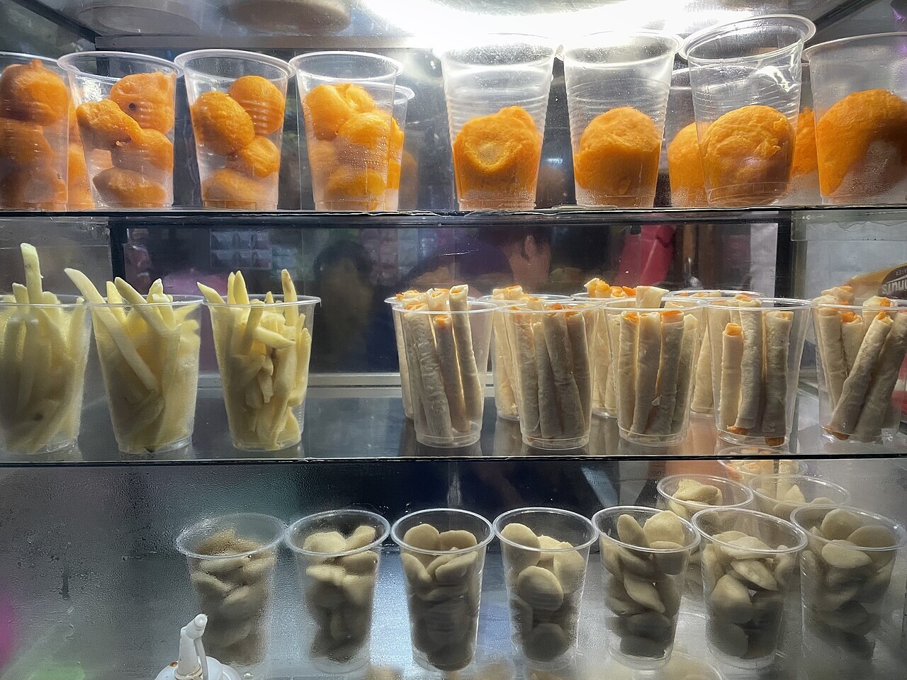 Kwek-Kwek: Orange-Battered Quail Eggs with Sweet-Spicy Sauce - Filipino street food kwek-kwek.