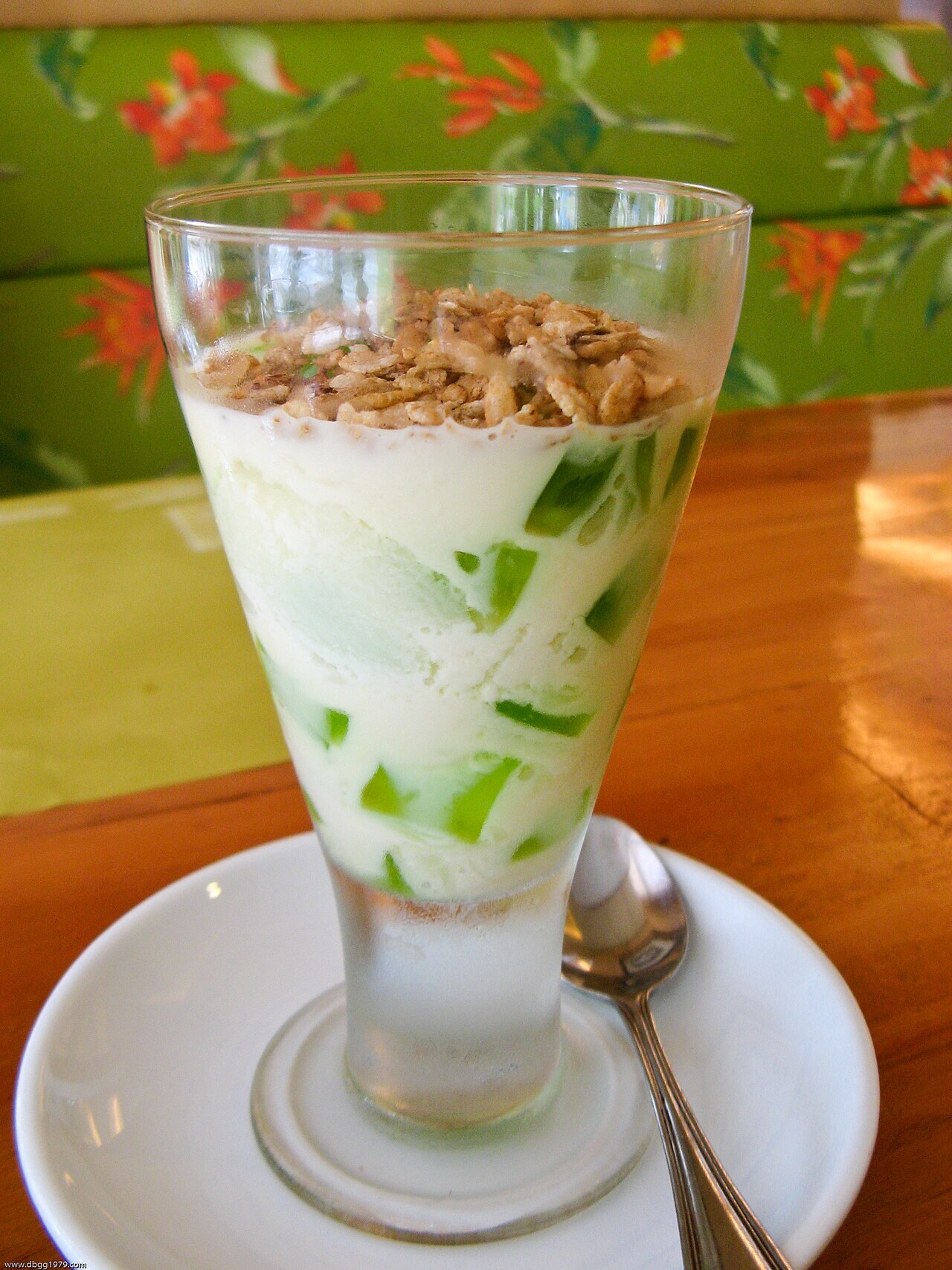 Buko Pandan: Filipino Coconut Pandan Dessert - Buko pandan served in a restaurant glass.
