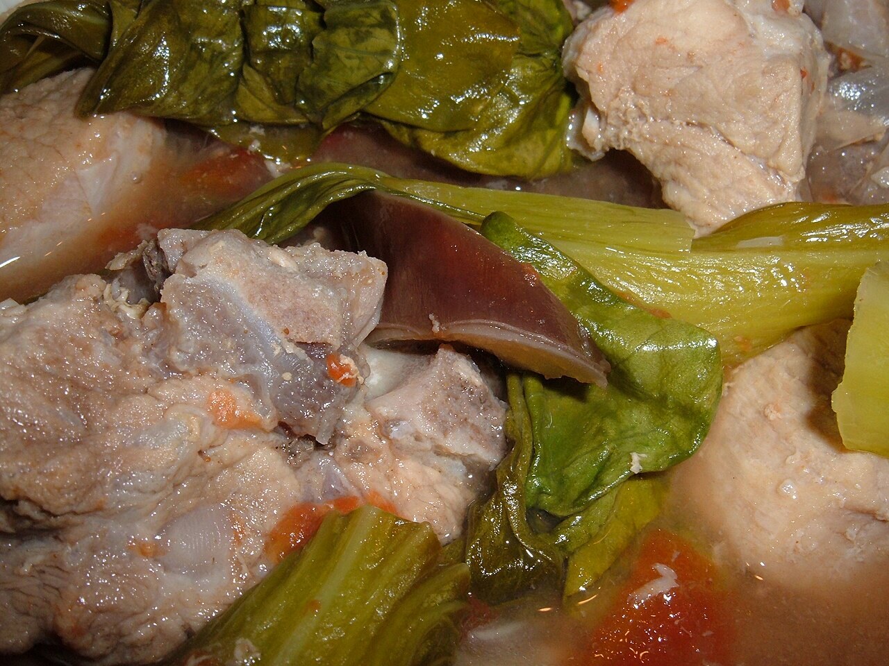 Pork Sinigang: Filipino Tamarind Soup with Vegetables - Pork sinigang close-up.