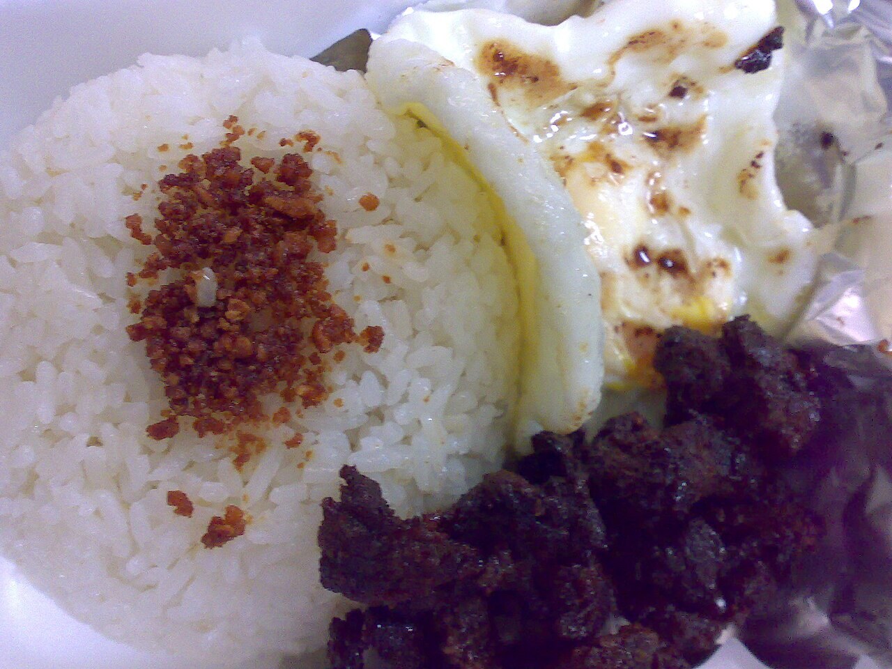 Tapsilog: Filipino Beef Tapa Breakfast Plate - Tapsilog: Tapa, Sinangag at Itlog. (Jerked beef, fried garlic rice and fried egg).