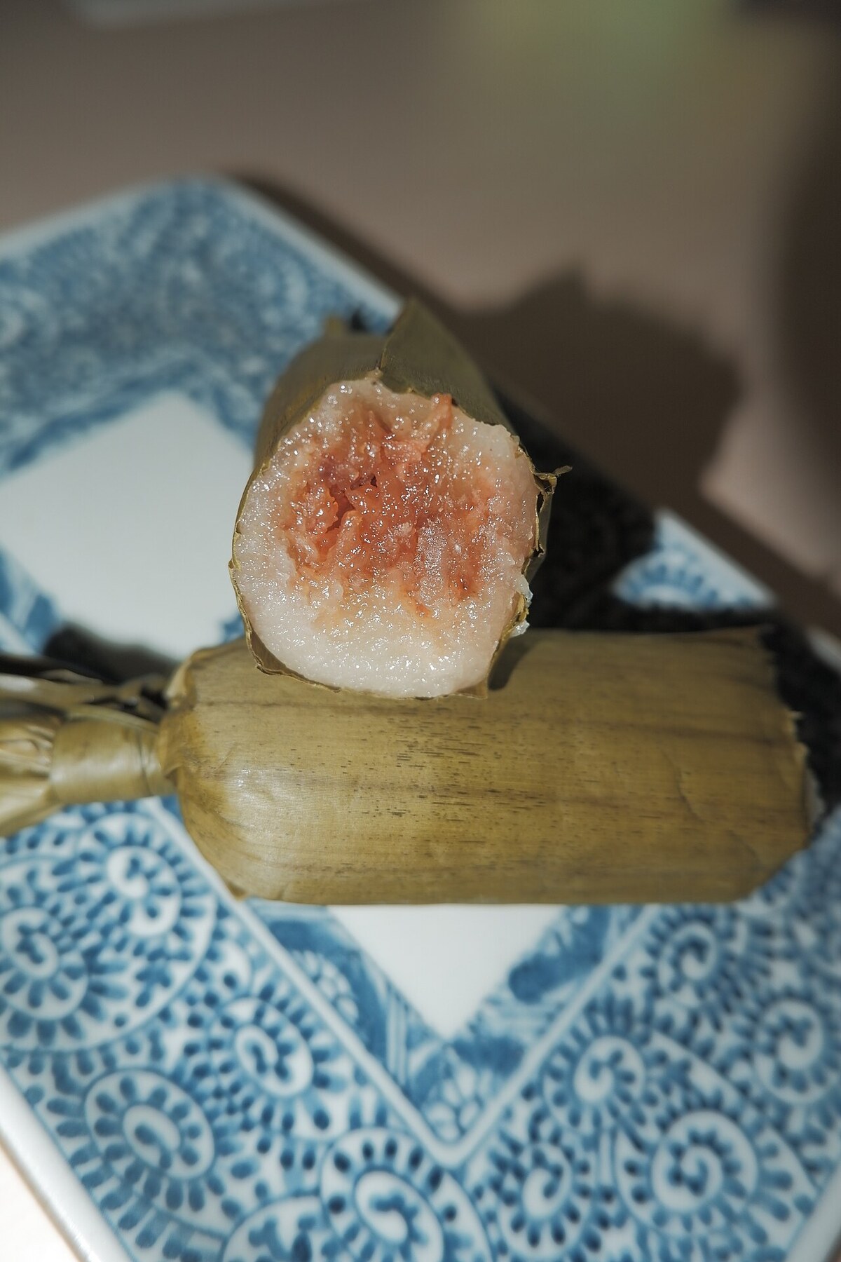 Cassava Suman: Coconut Cassava Bundles - Cassava Suman serving photo.