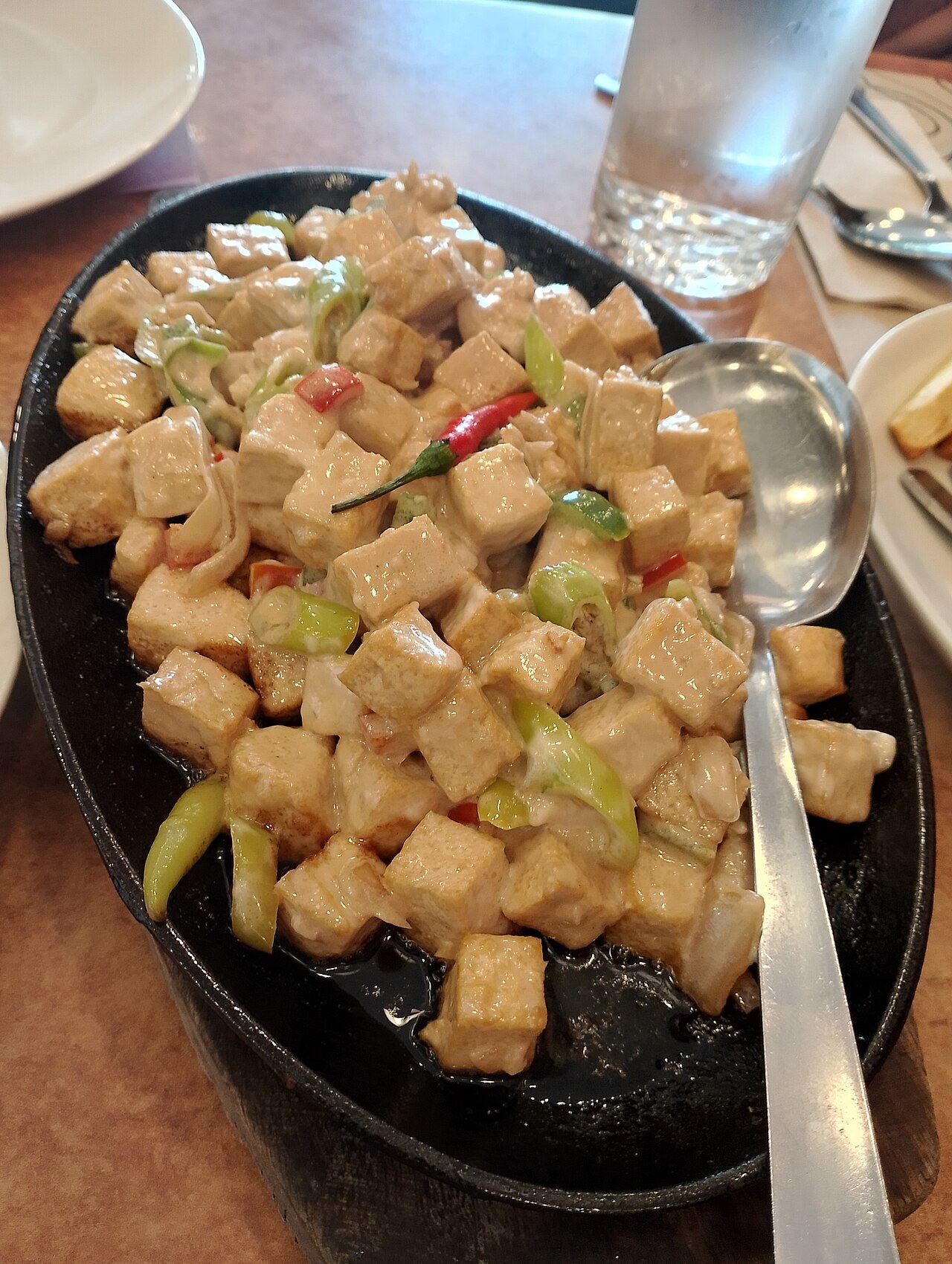 Tofu Sisig: Crispy Tofu with Calamansi, Chiles, and Creamy Sauce - Max's Sizzling Tofu Sisig.