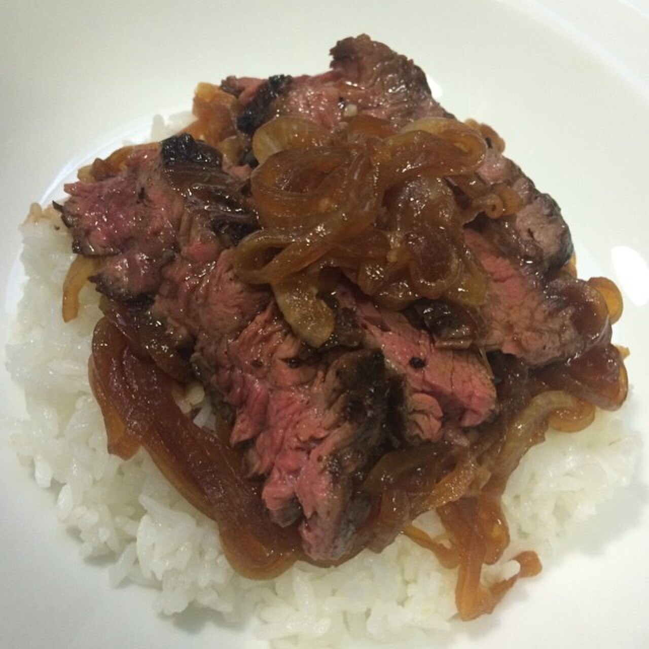 Bistek Tagalog: Calamansi Soy Beef with Onions - Bistek with caramelized onions and calamansi-soy sauce.
