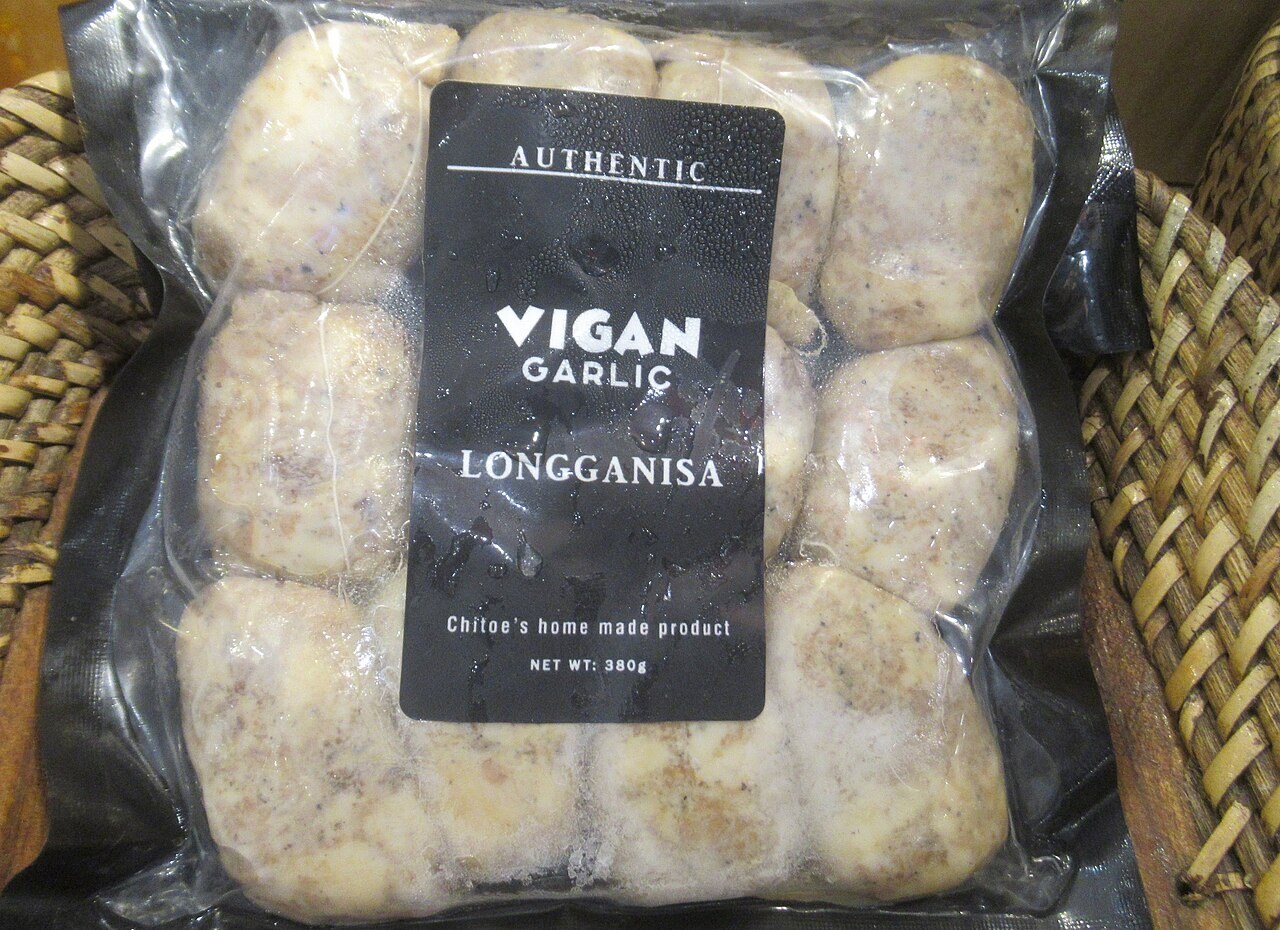 Longganisa Pasta with Garlic, Tomatoes, and Greens - Vigan garlic longganisa for the pasta's sweet-savory sausage base.