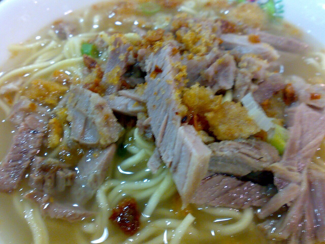 La Paz Batchoy: Filipino Pork Noodle Soup - Close-up view of a bowl of La Paz Batchoy.