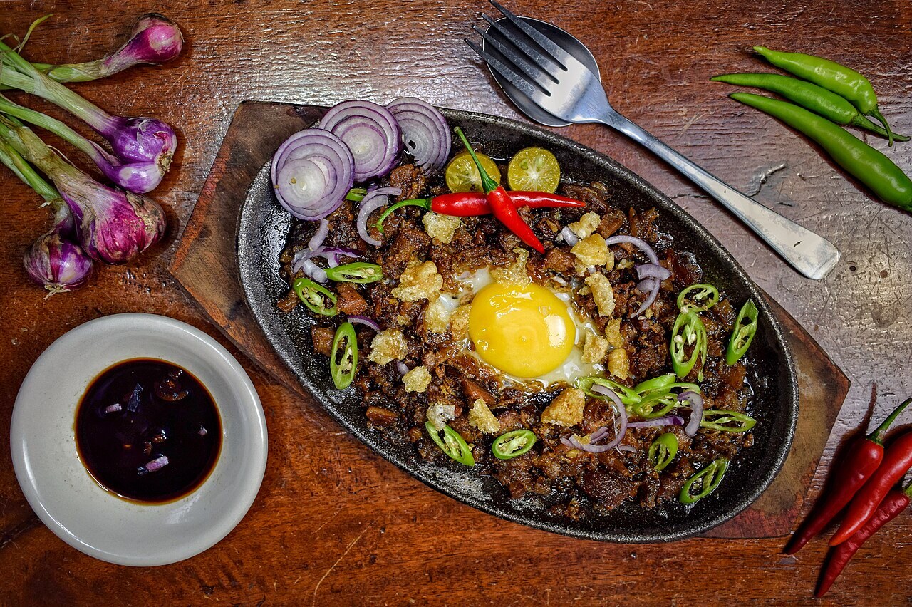 Pork Sisig: Sizzling Filipino Pork with Calamansi - Sizzling sisig platter.