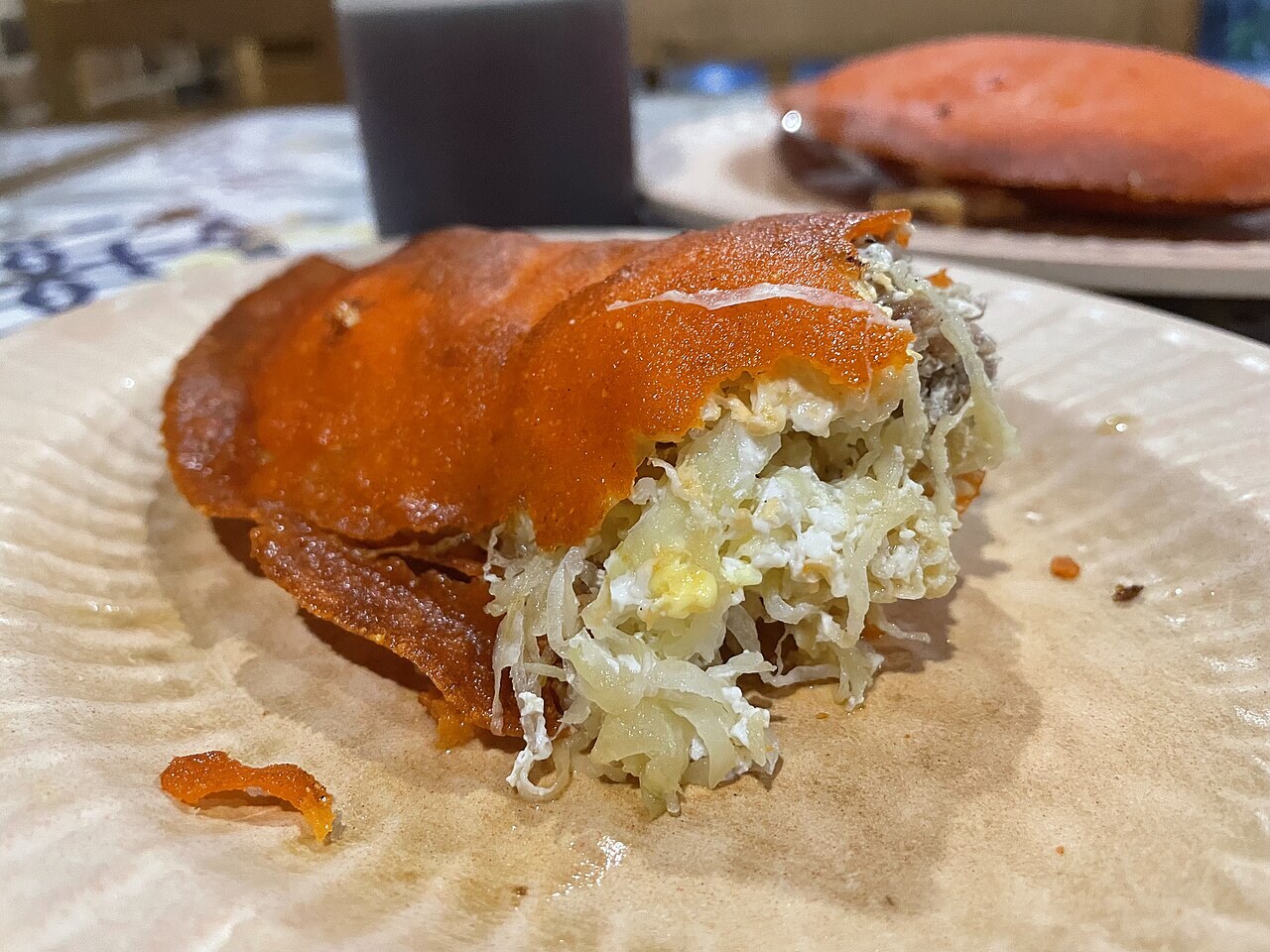 Ilocos Empanada: Crispy Orange Empanada with Longganisa and Egg - Empanada Ilocos.