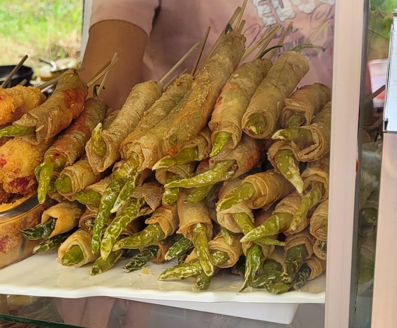 Dynamite Lumpia: Cheese-Stuffed Chile Spring Rolls - Dynamite lumpia (Dinamita) at a street food stall (Philippines).