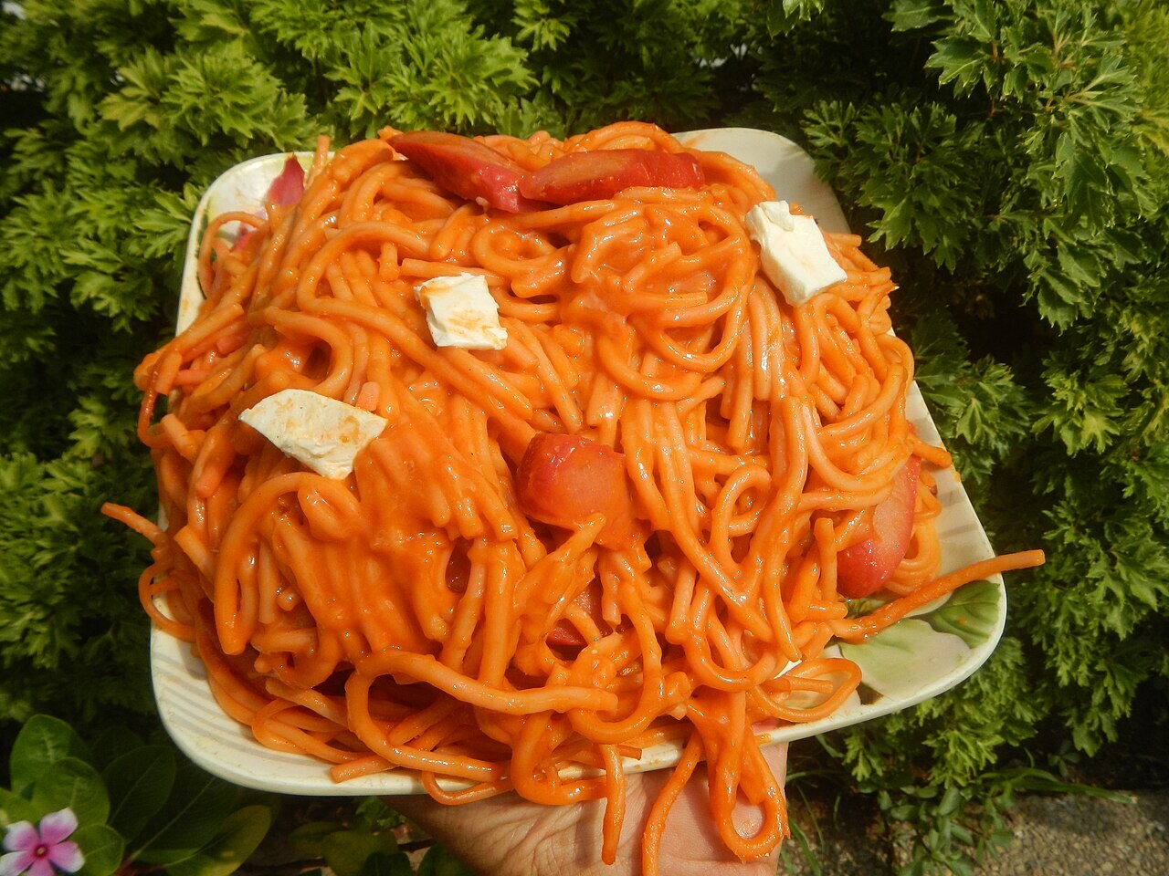 Filipino Spaghetti Party Tray - Filipino spaghetti with hot dogs and cheese.