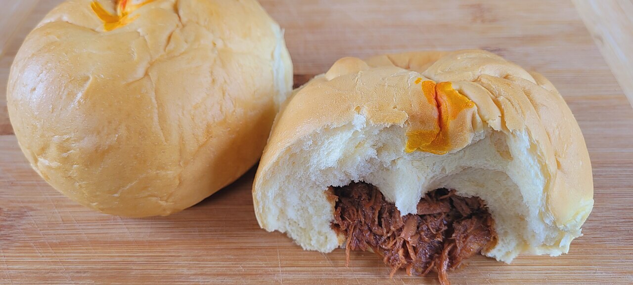 Siopao Asado: Steamed Filipino Buns with Sweet Pork Filling - Asado roll (baked siopao) from the Philippines.
