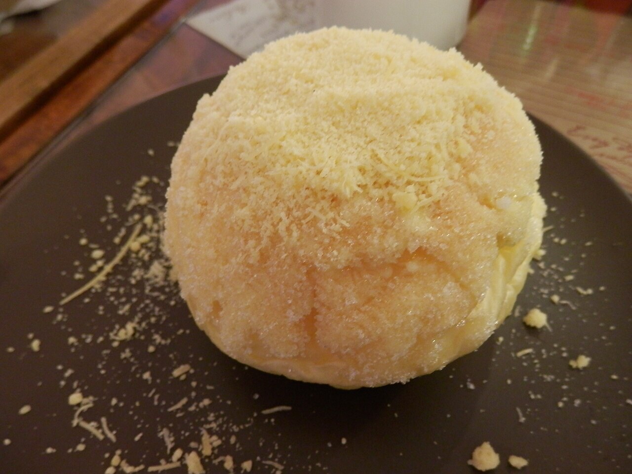 Filipino Cheese Rolls: Soft Bakery Rolls with Sweet Butter - Ensaymada - sweet bread rolls sprinkled with butter and cheese.