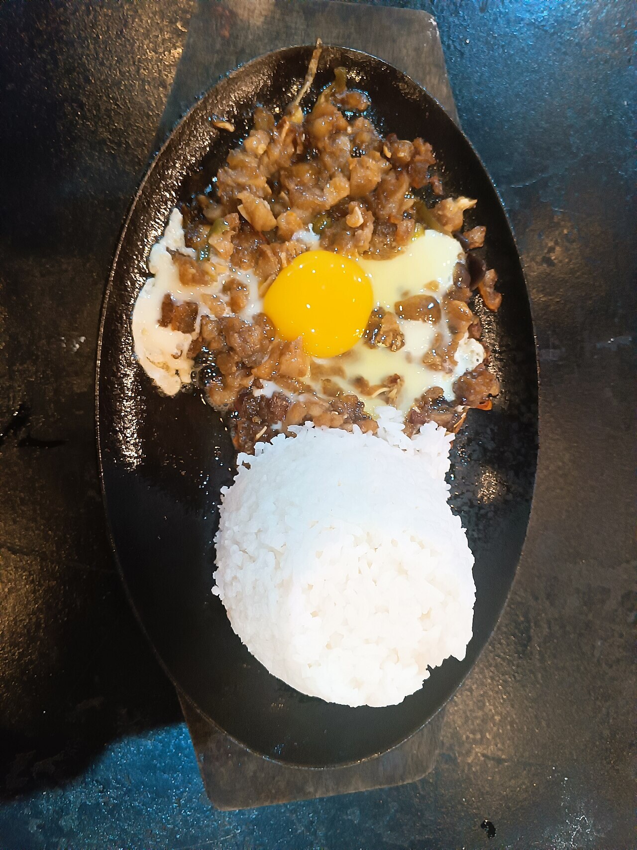 Sisig Fried Rice with Crispy Pork and Egg - Sisig with egg and rice.