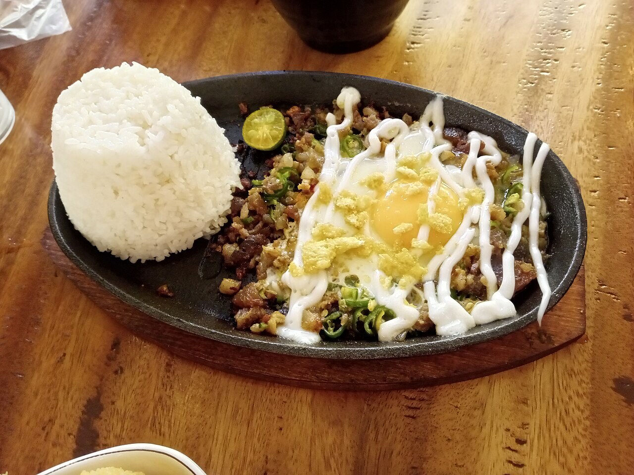 Sisig Fried Rice with Crispy Pork and Egg - Pork sisig rice.