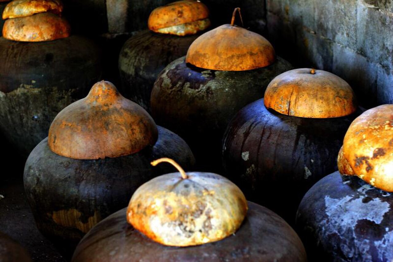 Filipino Pantry Starter: Sauces, Vinegars, Rice, and Flavor Builders - Burnay jars used for bagoong fermentation.