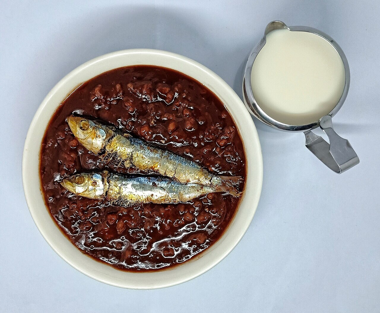 Champorado: Filipino Chocolate Rice Porridge - Champorado with milk and tuyo.