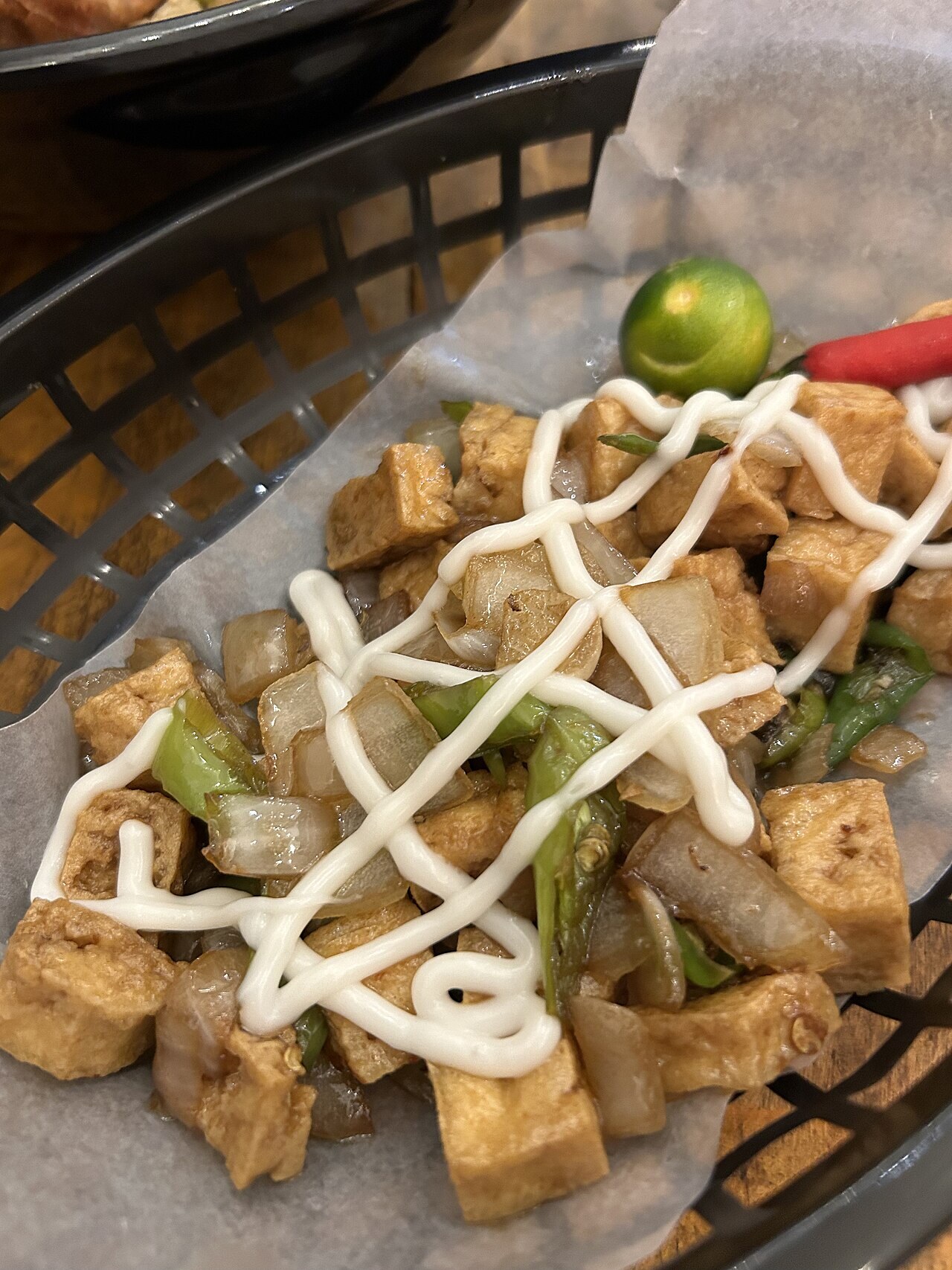 Tofu Sisig: Crispy Tofu with Calamansi, Chiles, and Creamy Sauce - Tofu (a.k.a. "tokwa") Sisig is a Filipino dish made of crispy fried tofu tossed with onions, chili, and a tangy, savo.