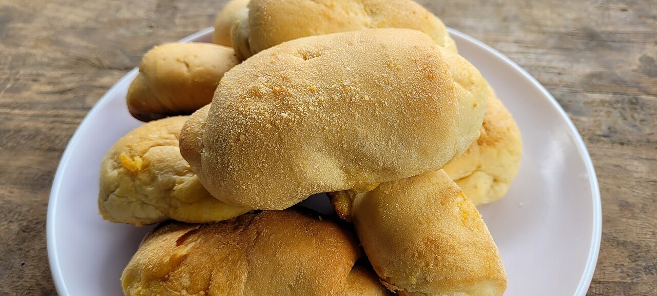 Spanish Bread: Filipino Bakery Rolls with Buttery Filling - Spanish bread close-up.
