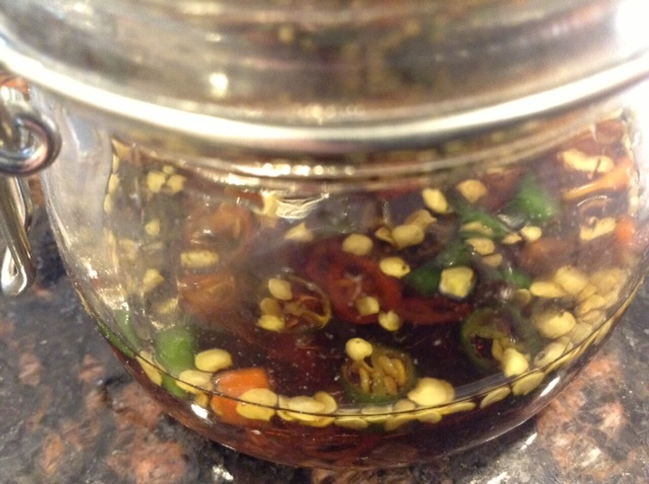 Filipino Pantry Starter: Sauces, Vinegars, Rice, and Flavor Builders - Fish sauce with chiles as a Filipino pantry condiment.
