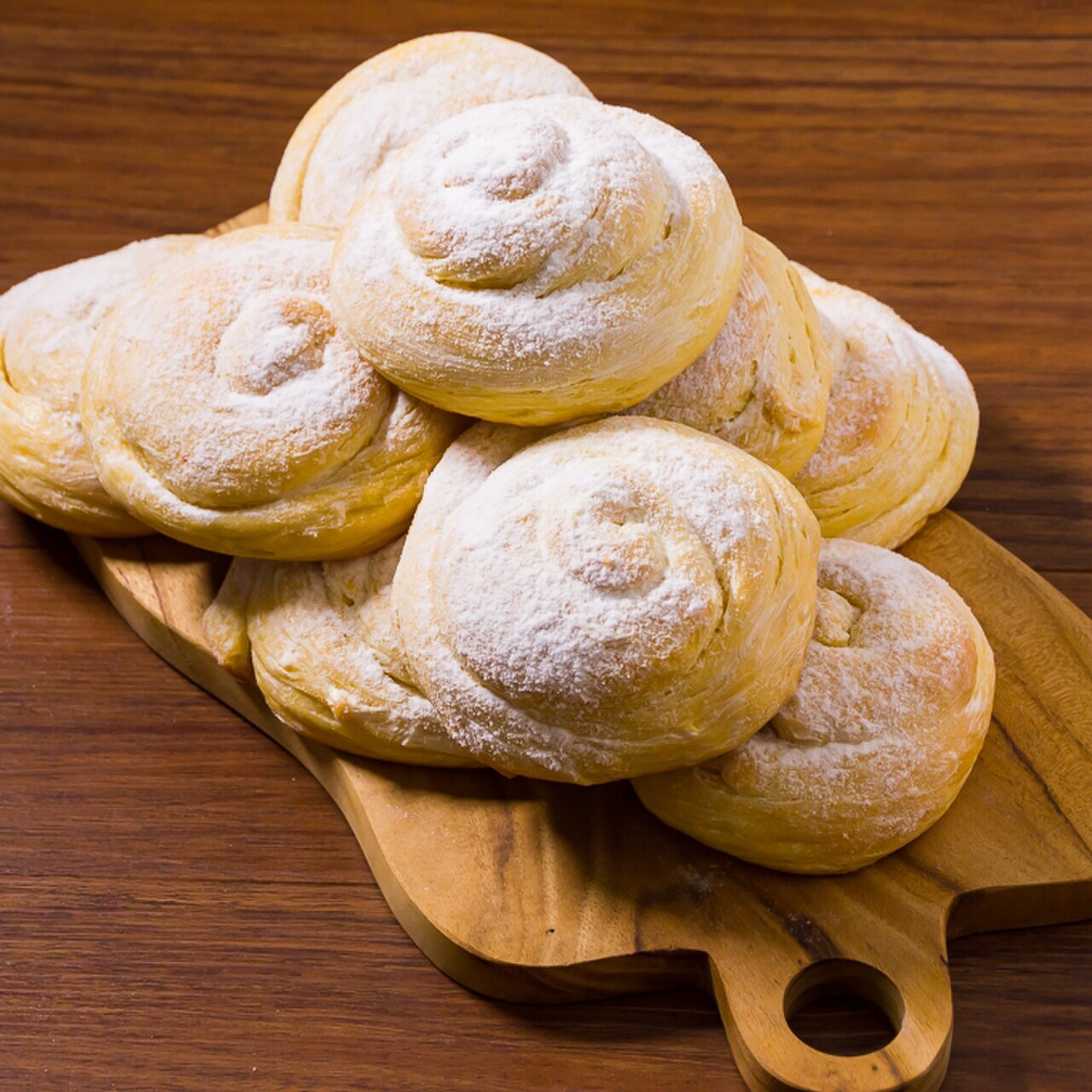 Ensaymada: Filipino Brioche with Butter, Sugar, and Cheese - Filipino sweet buns with cheese.