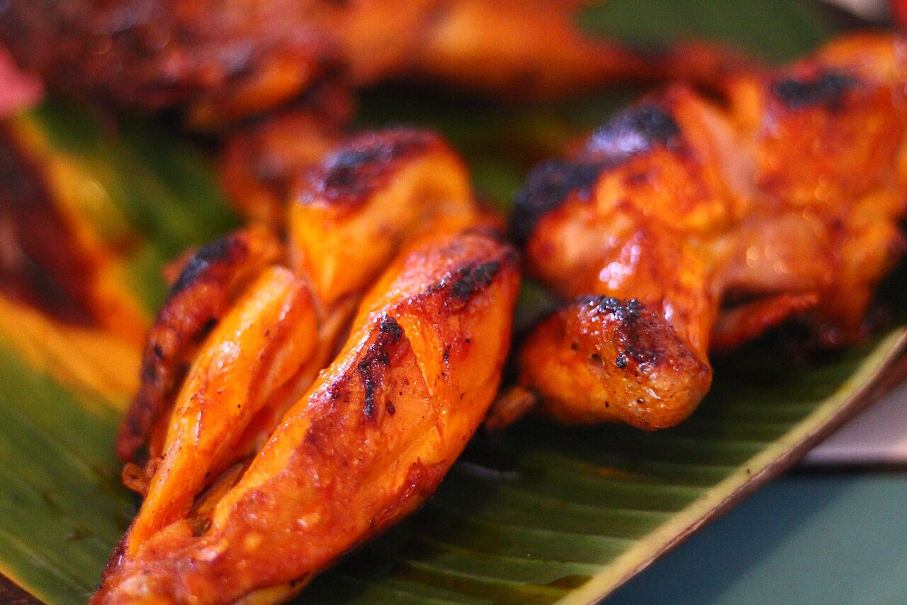 Chicken Inasal: Filipino Grilled Chicken with Annatto Oil - Chicken inasal with grilled char.