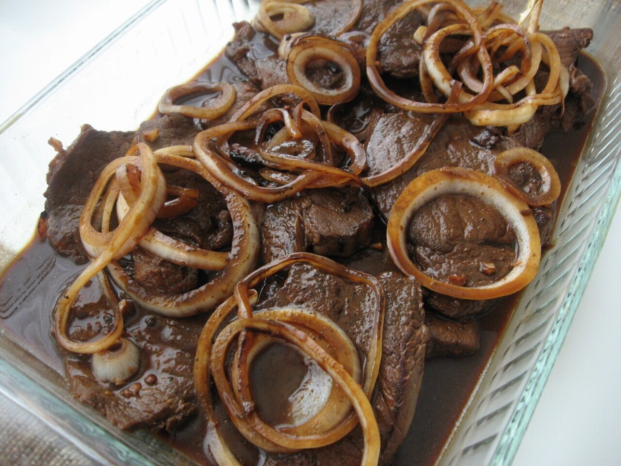 Bistek Tagalog: Calamansi Soy Beef with Onions - Bistek Tagalog family-style.