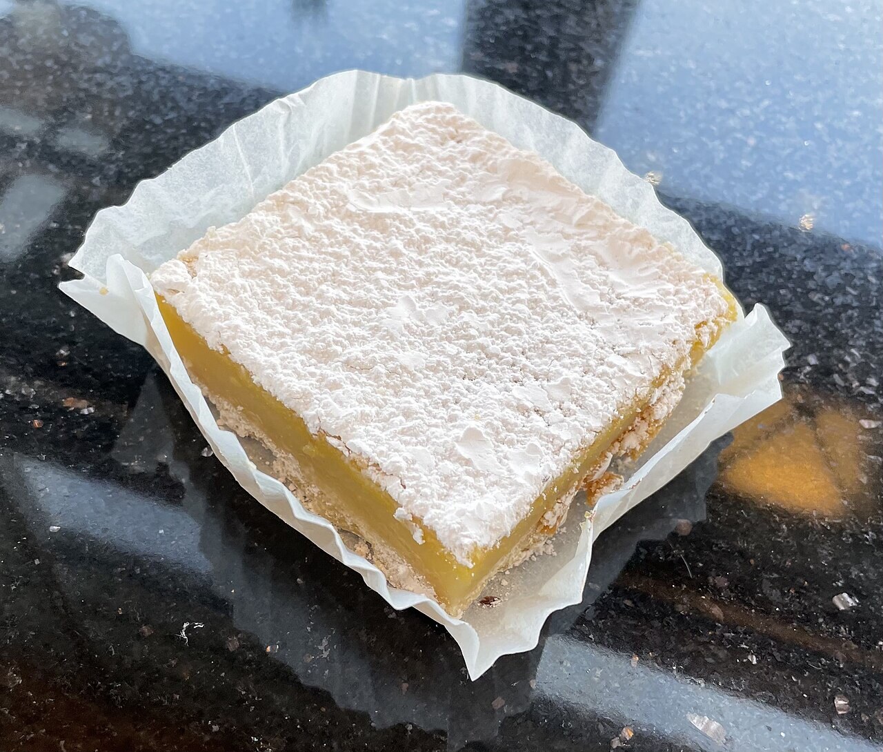 Calamansi Bars: Filipino Citrus Dessert Bars - A single citrus dessert bar.