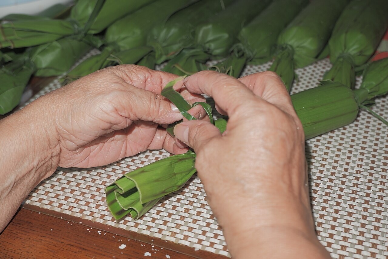 Cassava Suman: Coconut Cassava Bundles - Candy-like banana leaf wrapping of cassava suman or 'balinghoy' with bukayo filling.
