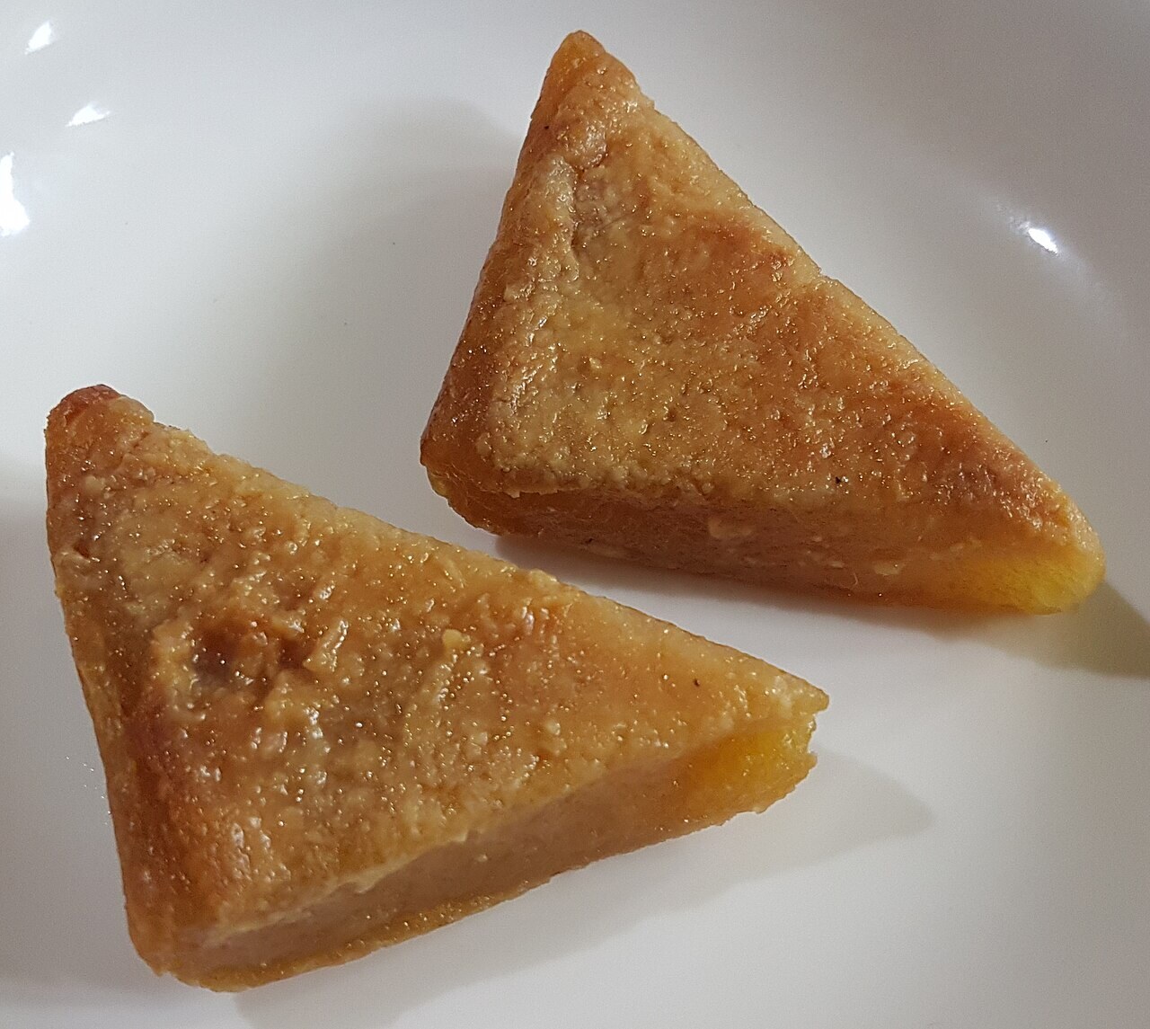 Cassava Cake: Filipino Coconut Cassava Dessert - Cassava cake pieces.