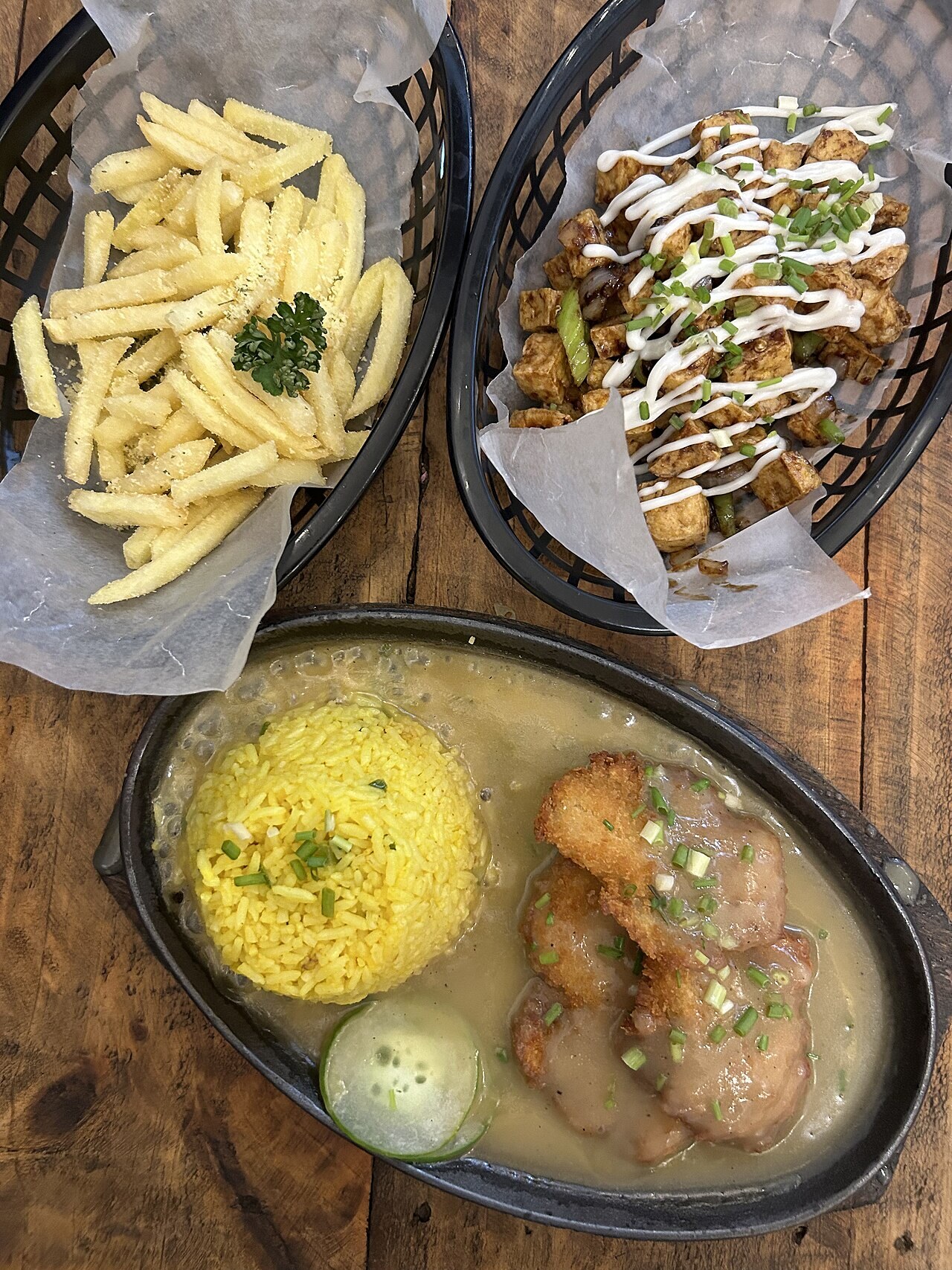 Tofu Sisig: Crispy Tofu with Calamansi, Chiles, and Creamy Sauce - French fries, tofu sisig, burger patty.